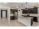 Modern kitchen featuring stainless steel appliances, a large island and white subway tile backsplash at 9548 E Rainbow Ave, Mesa, AZ 85212