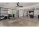 Open floorplan with carpeted living room flowing into a kitchen with stainless steel appliances at 9548 E Rainbow Ave, Mesa, AZ 85212