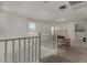 Loft with large windows and neutral carpet throughout at 9548 E Rainbow Ave, Mesa, AZ 85212