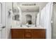 Bathroom with double sinks, a wooden vanity, and a shower with a white curtain at 10239 W Via Del Sol -- # 400, Peoria, AZ 85383