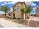 Well-maintained two-story home with desert landscaping, neutral stucco, and a brick driveway at 10239 W Via Del Sol -- # 400, Peoria, AZ 85383