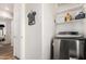 The convenient laundry room boasts modern machines and built-in shelving for extra storage at 10239 W Via Del Sol -- # 400, Peoria, AZ 85383