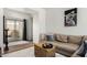 Cozy living room featuring a comfortable sofa and view of the backyard at 10239 W Via Del Sol -- # 400, Peoria, AZ 85383