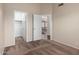 Bedroom featuring carpet, open closet, and view to living area at 1279 N Blackstone Dr, Chandler, AZ 85224