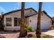 Inviting single-story home featuring a two-car garage and desert landscaping at 1279 N Blackstone Dr, Chandler, AZ 85224