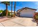 Inviting single-story home with a two-car garage and low maintenance desert landscaping at 1279 N Blackstone Dr, Chandler, AZ 85224