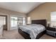 Bright main bedroom features neutral tones and a slider to the outdoor space at 1279 N Blackstone Dr, Chandler, AZ 85224
