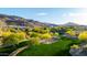Neighborhood aerial view of park, desert landscaping, and stunning mountain backdrop on a sunny day at 1330 E Monte Way, Phoenix, AZ 85042