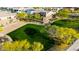 Aerial view of community park with sand volleyball court, grassy areas, trees, and walking path at 1330 E Monte Way, Phoenix, AZ 85042