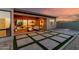 Relaxing covered back patio with a fire pit, stylish seating, and easy indoor/outdoor living at 1330 E Monte Way, Phoenix, AZ 85042