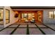 Relaxing covered back patio with a fire pit, stylish seating, and easy indoor/outdoor living at 1330 E Monte Way, Phoenix, AZ 85042