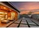 A large backyard with a covered patio, seating and a fire pit provides the perfect space for outdoor gatherings at 1330 E Monte Way, Phoenix, AZ 85042