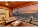 Backyard showcasing an inviting outdoor living space with a cozy couch, fire pit, and neatly designed patio at 1330 E Monte Way, Phoenix, AZ 85042