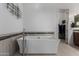 Freestanding white bathtub with chrome fixtures and a modern tile surround and decorative art at 1330 E Monte Way, Phoenix, AZ 85042