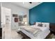 A nicely decorated bedroom offers a comfortable bed, decor, and an open door to the private backyard at 1330 E Monte Way, Phoenix, AZ 85042