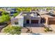 Stylish modern home with stone accents, desert landscaping, and a paved driveway at 1330 E Monte Way, Phoenix, AZ 85042