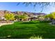 The grassy outdoor area offers beautiful mountain views and a community fireplace at 1330 E Monte Way, Phoenix, AZ 85042