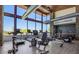 Well-equipped gym with treadmills, weights, and floor-to-ceiling windows overlooking picturesque views at 1330 E Monte Way, Phoenix, AZ 85042