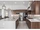 Contemporary kitchen featuring a large island, stainless steel appliances, and ample counter space at 1330 E Monte Way, Phoenix, AZ 85042