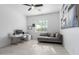 Bright home office with tile floor, white desk, sofa and window with bright sunlight at 1330 E Monte Way, Phoenix, AZ 85042
