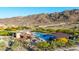 Community pool showcasing lounge chairs, desert landscaping, and serene mountain views at 1330 E Monte Way, Phoenix, AZ 85042