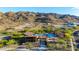 Community pool featuring a modern clubhouse, lounge chairs, desert landscape, and mountain views at 1330 E Monte Way, Phoenix, AZ 85042