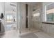 Frameless glass shower features tile surround, rain shower head, and sleek fixtures at 1330 E Monte Way, Phoenix, AZ 85042