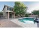 Inviting backyard featuring a refreshing pool, perfect for relaxing and entertaining outdoors at 15028 W Columbine Dr, Surprise, AZ 85379