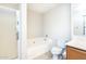 Clean bathroom featuring a corner tub and shower at 15028 W Columbine Dr, Surprise, AZ 85379