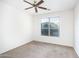 Cozy bedroom featuring a ceiling fan and a window that lets in natural light at 15028 W Columbine Dr, Surprise, AZ 85379