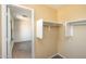Walk-in closet with shelf and rod system, viewed from bedroom at 15028 W Columbine Dr, Surprise, AZ 85379