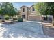 Attractive home with manicured landscaping, a spacious driveway, and a welcoming facade at 15028 W Columbine Dr, Surprise, AZ 85379