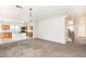 Spacious living room with kitchen views, offering an open layout perfect for entertaining guests and Gathering at 15028 W Columbine Dr, Surprise, AZ 85379