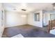 Expansive living area with modern light fixture, open spaces, and easy access to staircase at 15028 W Columbine Dr, Surprise, AZ 85379