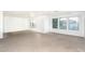 Well-lit living room featuring several windows for lots of natural light at 15028 W Columbine Dr, Surprise, AZ 85379