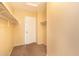 Organized walk-in closet featuring shelves and hanging rods at 15028 W Columbine Dr, Surprise, AZ 85379