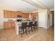 Spacious kitchen with ample counter space, stainless steel appliances, and a center island with barstool seating at 15288 W Redfield Rd, Surprise, AZ 85379