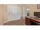 Office space features a wooden desk, closet space and bright walls with carpeted floor at 15288 W Redfield Rd, Surprise, AZ 85379