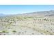 A desert landscape view with the community in the distance at 15550 S 5Th Ave # 130, Phoenix, AZ 85045