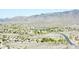 Expansive aerial view of a desert community nestled against a backdrop of majestic mountains at 15550 S 5Th Ave # 130, Phoenix, AZ 85045
