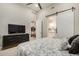 Bedroom featuring a sliding barn door, a dresser, and natural light at 15550 S 5Th Ave # 130, Phoenix, AZ 85045
