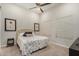 Bright bedroom with ceiling fan, natural light and carpet flooring at 15550 S 5Th Ave # 130, Phoenix, AZ 85045
