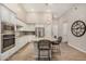 Kitchen with stainless steel appliances, a large island, and hardwood floors at 15550 S 5Th Ave # 130, Phoenix, AZ 85045