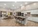 Contemporary kitchen featuring sleek white cabinetry, granite countertops, and stylish pendant lighting at 15550 S 5Th Ave # 130, Phoenix, AZ 85045