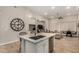 Bright kitchen featuring a large island with bar seating, perfect for casual dining and entertaining at 15550 S 5Th Ave # 130, Phoenix, AZ 85045