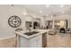 Spacious kitchen with granite island and pendant lighting opening up to a large living area at 15550 S 5Th Ave # 130, Phoenix, AZ 85045