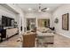 Bright living room features neutral colors, modern decor, and large windows for natural light at 15550 S 5Th Ave # 130, Phoenix, AZ 85045