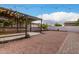 Expansive backyard featuring a charming pergola, creating an inviting outdoor space for relaxation and entertaining at 16183 W Devonshire Ave, Goodyear, AZ 85395