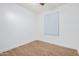 Bedroom showcasing bright natural light, neutral walls, and modern wood-look flooring at 16183 W Devonshire Ave, Goodyear, AZ 85395