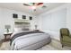 Comfortable bedroom features a ceiling fan and neutral decor at 16183 W Devonshire Ave, Goodyear, AZ 85395